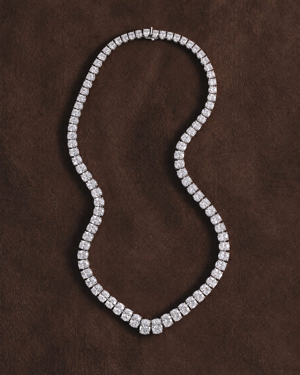 A diamond necklace on brown leather
