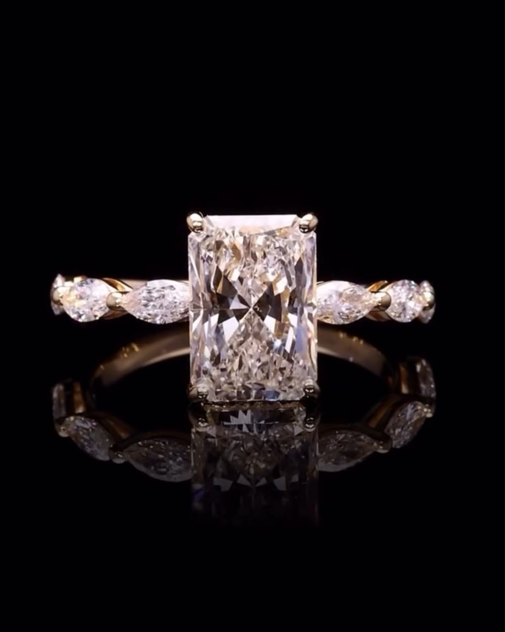 Radiant diamond ring with marquise side stones