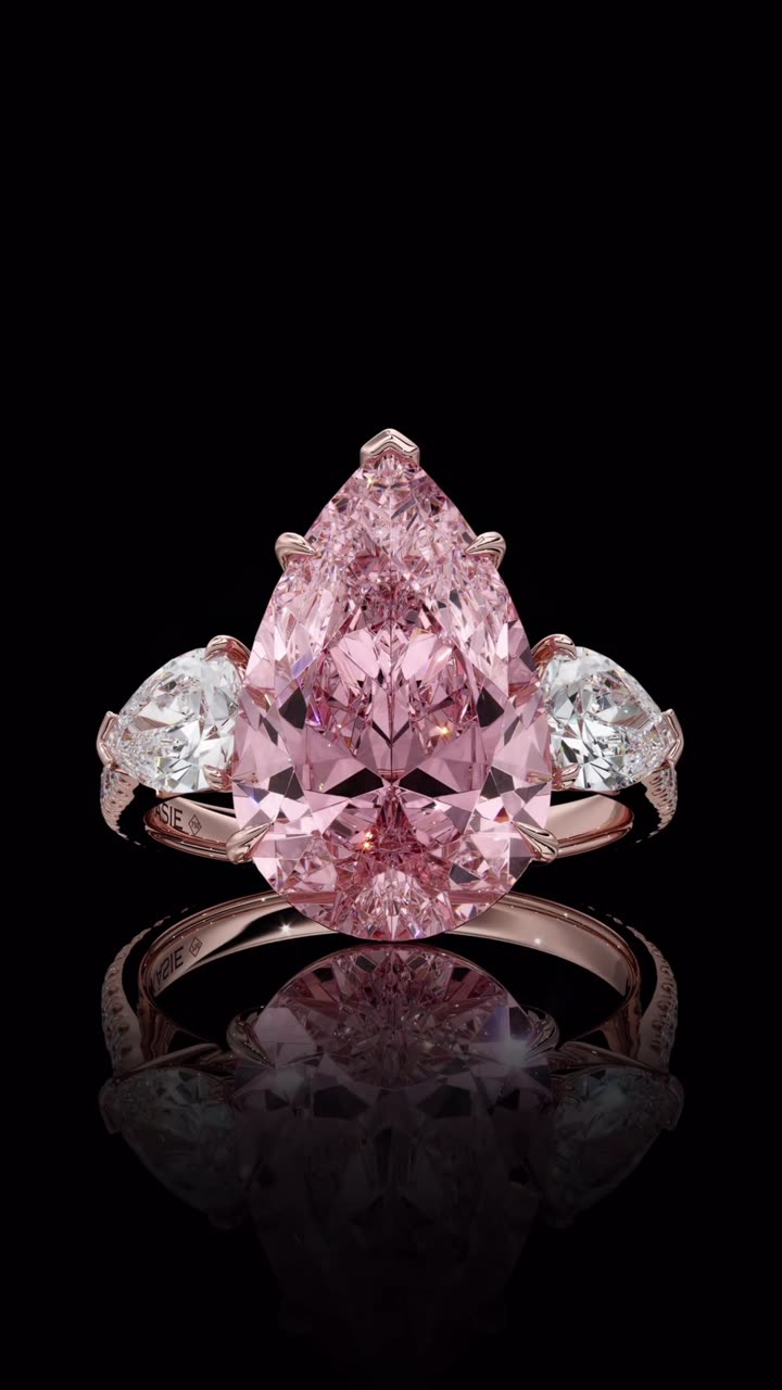 Pink pear diamond ring with side stones